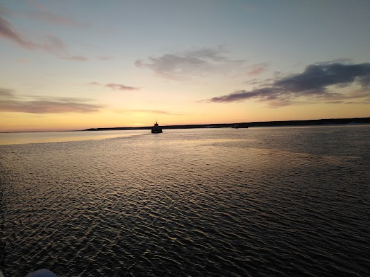 Cross the Ob River by ferry or bridge approach